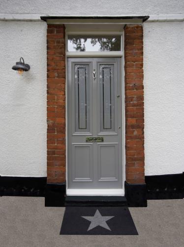 Custom made Front Door with etched glass and door knob, letterbox and security locking system